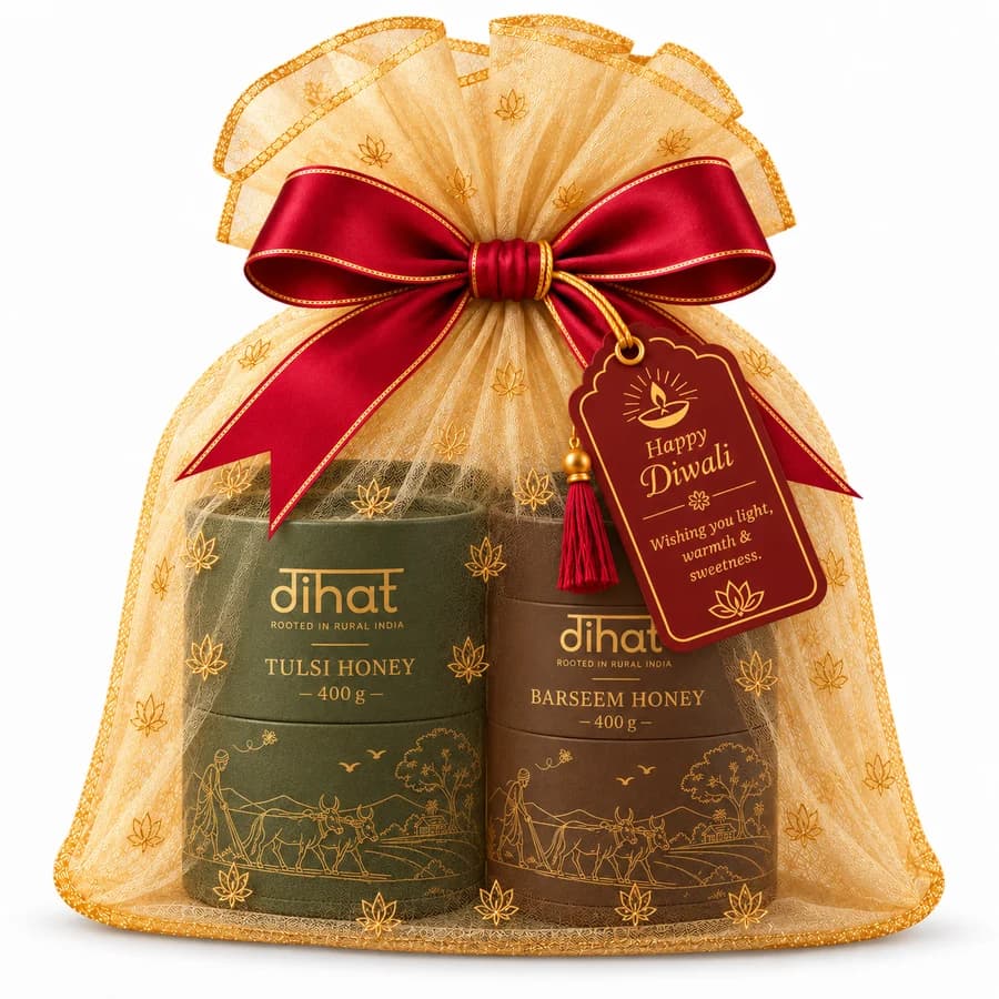 A Dihat Duo gift of Tulsi and Barseem honey, wrapped in organza with a Happy Diwali tag